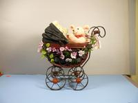 The carriage is rattan covered in pink flowers